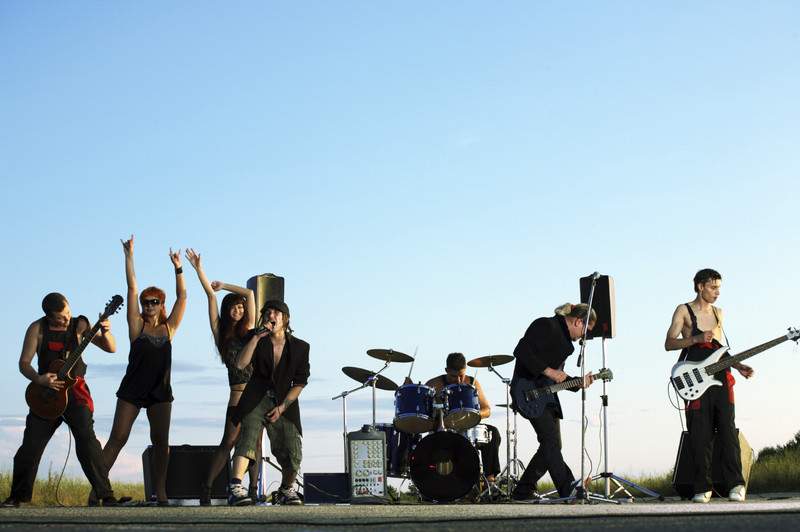 Musicians playing on a stage