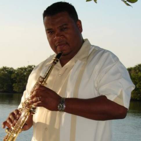 James Braxton holding saxaphone