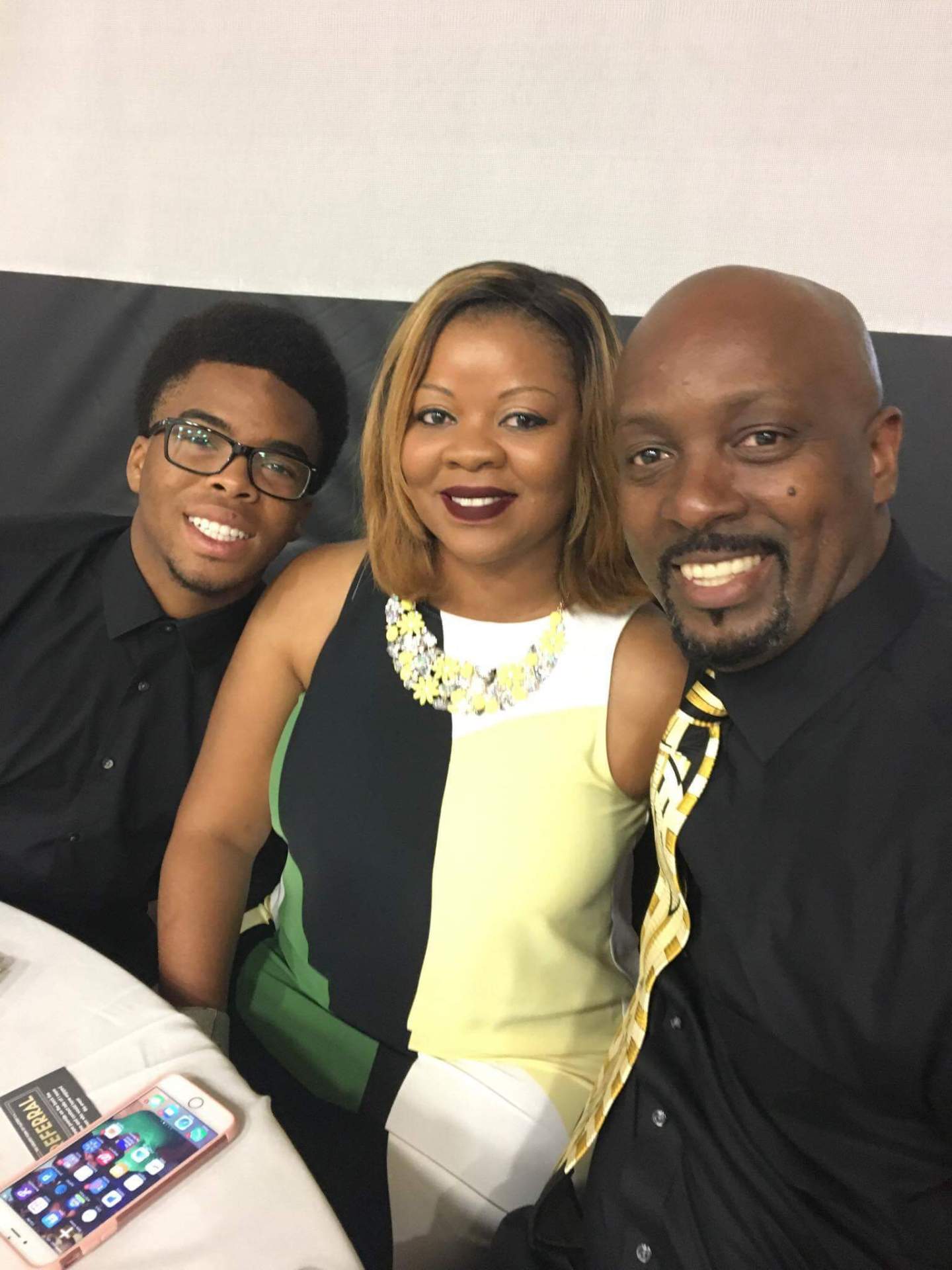 Three people seated at a table