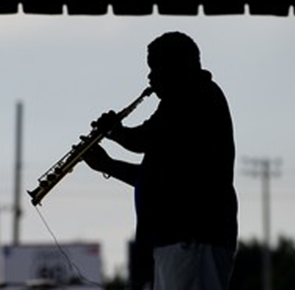 Photo Gallery - Man playing a saxophone
